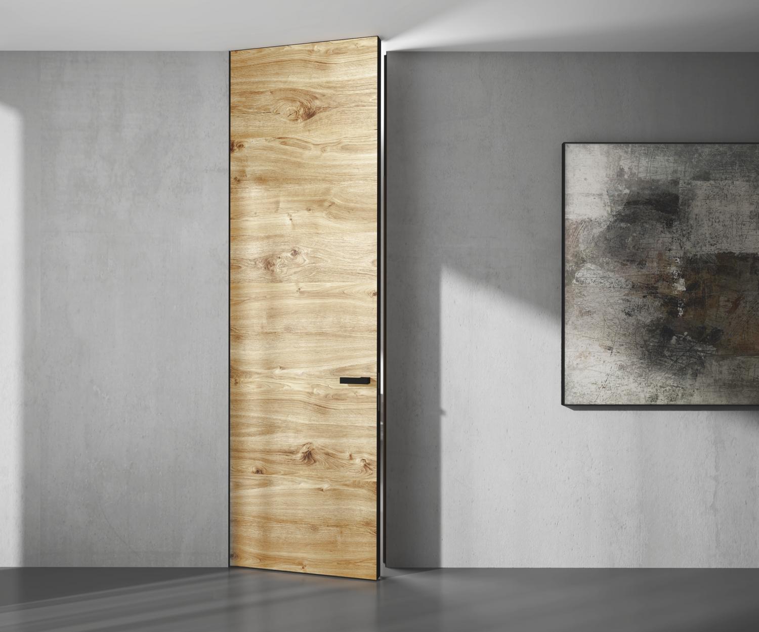 Concealed door with natural veneered wood finish in a minimalist concrete interior