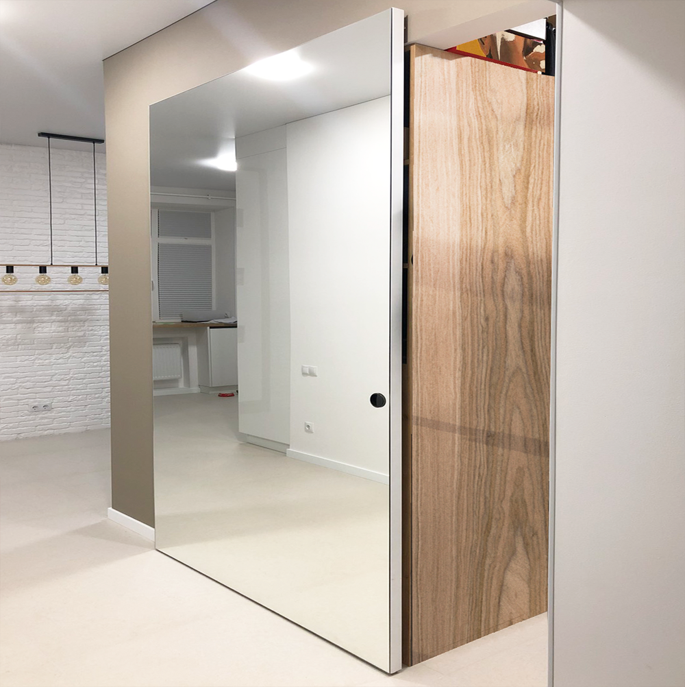 Mirror-faced sliding door with hidden tracks revealing wood interior